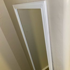 A nice white framed mirror!